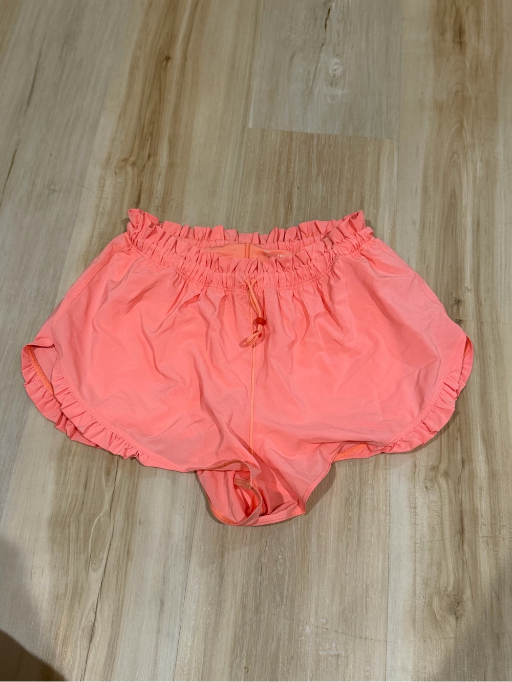 Women’s Coral Pink Ruffle Hem Shorts